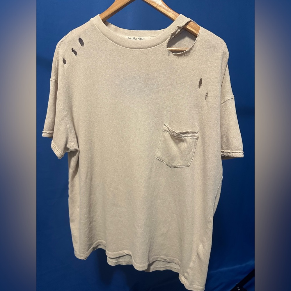 Free People We the Free collection oversized distressed t-shirt with holes.